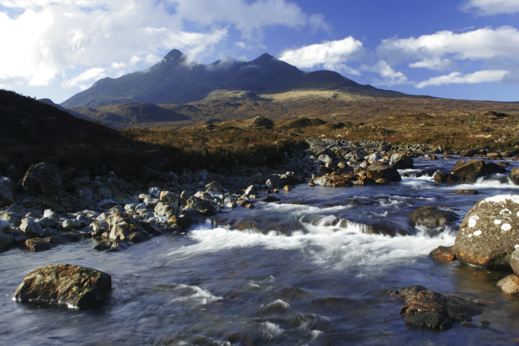 Scotland, The Isle of Skye, Sligachan. The River Sligachan flowing through the Glen Sligachan, dominated by the Cuillin Mountains.