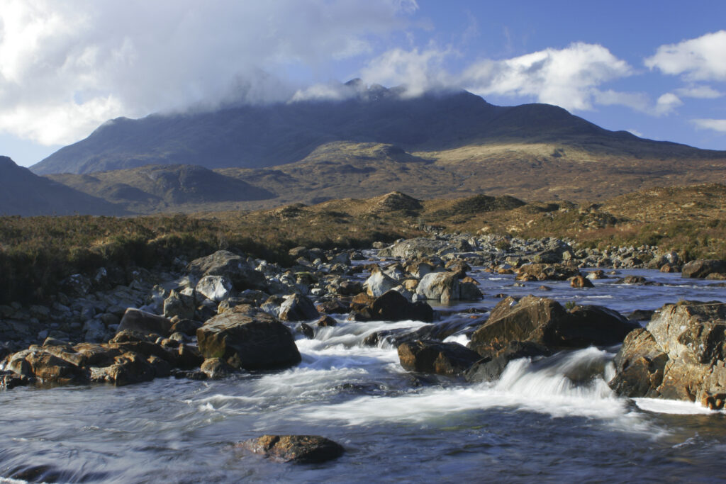 Scotland, The Isle of Skye, Sligachan. The River Sligachan flowing through the Glen Sligachan, dominated by the Cuillin Mountains.