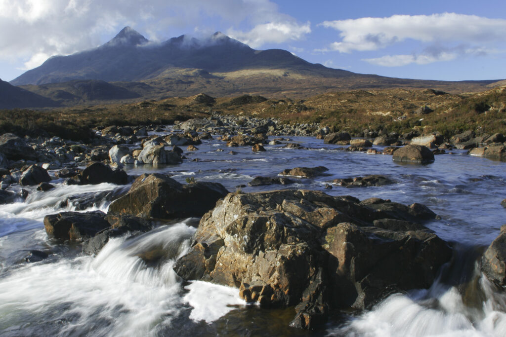 Scotland, The Isle of Skye, Sligachan. The River Sligachan flowing through the Glen Sligachan, dominated by the Cuillin Mountains.