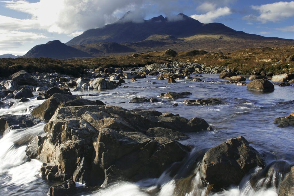 Scotland, The Isle of Skye, Sligachan. The River Sligachan flowing through the Glen Sligachan, dominated by the Cuillin Mountains.