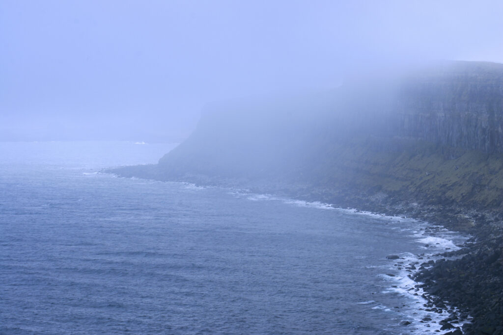 Scotland Isle Of Skye Kilt Rock Sea mist around the 200ft high cliffs of Kilt Rock on the Trotternish Peninsula