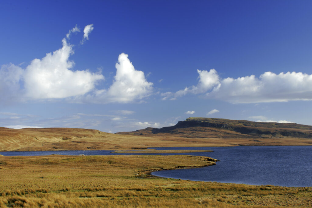 Scotland The Isle of Skye Loch Leathan Soft afternoon light illuminates Loch Leathan and surrounding moorland and hills