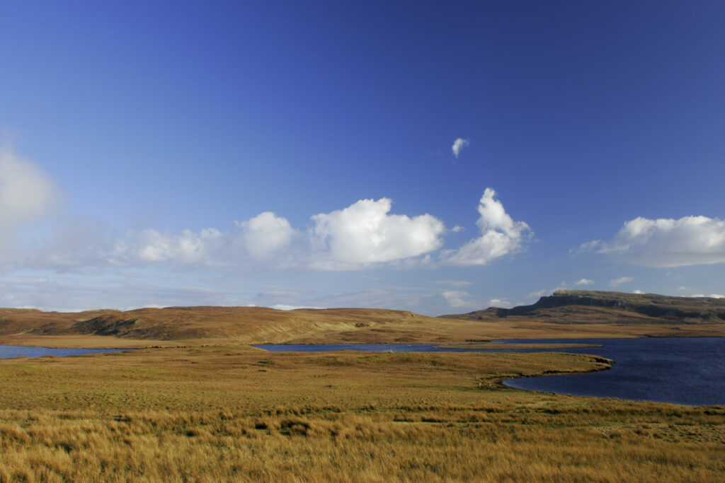 Scotland The Isle of Skye Loch Leathan Soft afternoon light illuminates Loch Leathan and surrounding moorland and hills