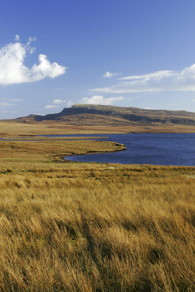 Scotland The Isle of Skye Loch Leathan Soft afternoon light illuminates Loch Leathan and surrounding moorland and hills