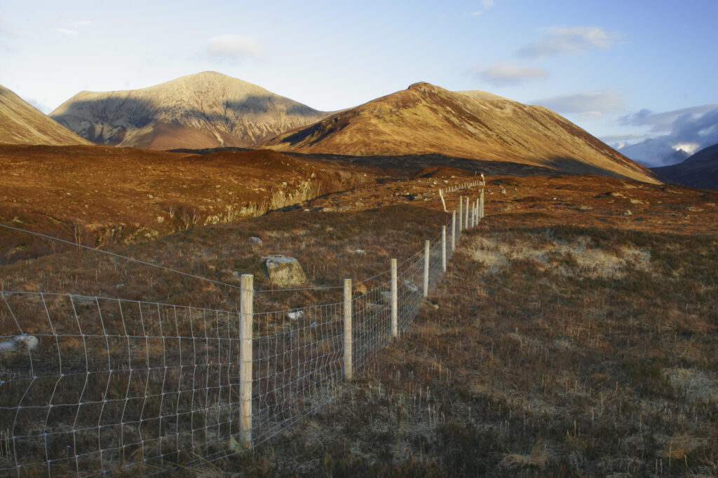Scotland Isle of Skye Glen Sligachan Evening light iluminates the red hues of the wild mountain landscape of Glen Sligachan
