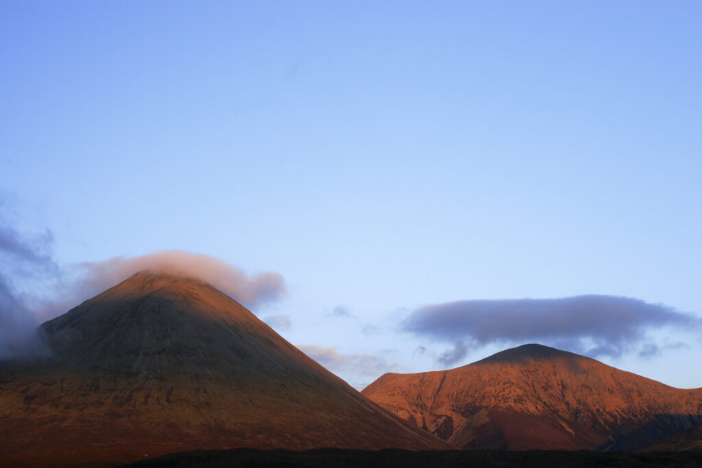 Scotland Isle of Skye Glen Sligachan Evening light iluminates the red hues of the wild mountain landscape of Glen Sligachan