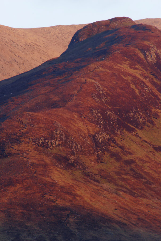 Scotland Isle of Skye Glen Sligachan Evening light iluminates the red hues of the wild mountain landscape of Glen Sligachan