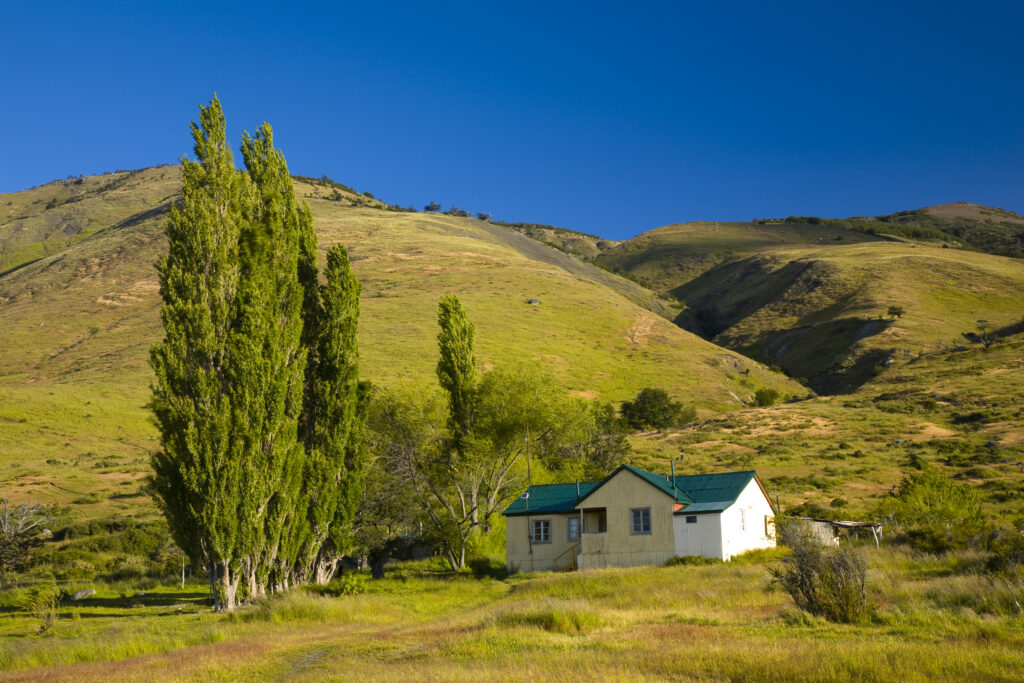 Argentina, Patagonia, Los Glaciares National Park. Rustic house located in the hills near Lake Roca.