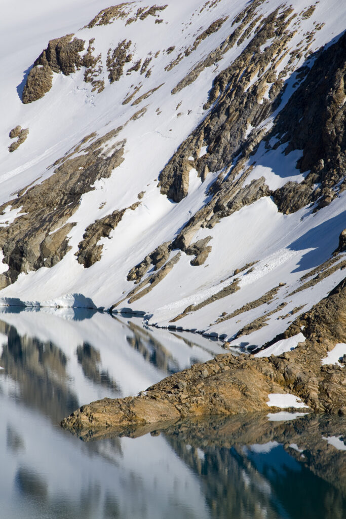 Argentina, Patagonia, Los Glaciares National Park. Foothills of Fitz Roy and surrounding mountains reflected in the de los tres lake.