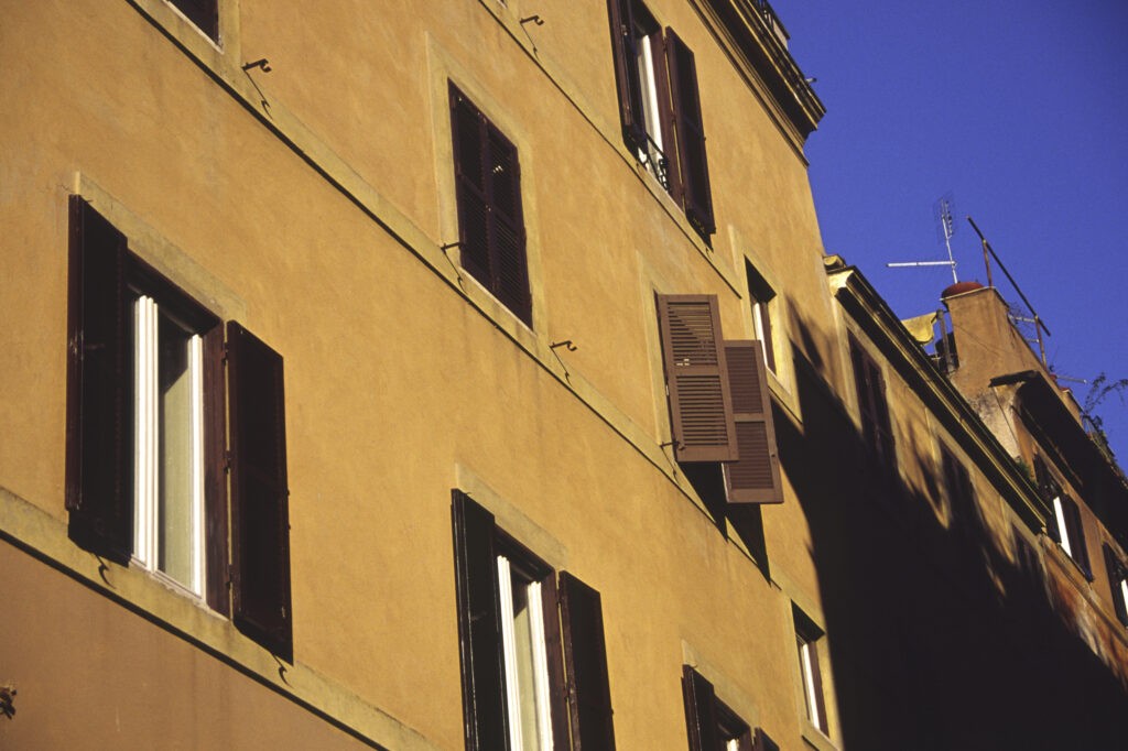 Italy, Lazio, Rome. The typical architecture and colours of Italian homes and flats in the city.