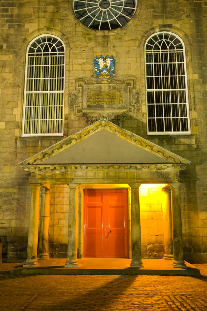 Scotland, Edinburgh, The Royal Mile. Canongate Kirk, located in Canongate a former separate burgh before becoming part of Edinburgh in 1856, was built in 1691 by Scottish architect James Smith.