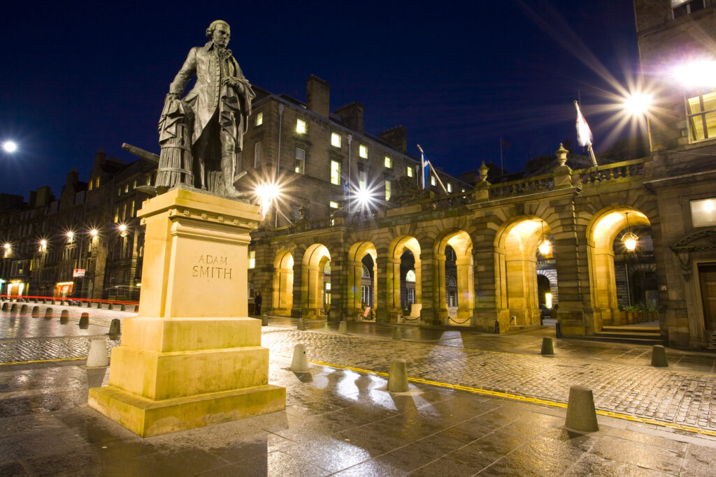 Scotland, Edinburgh, The Royal Mile. Monument to Adam Smith opposite the Edinburgh City Chambers on the Royal Mile.