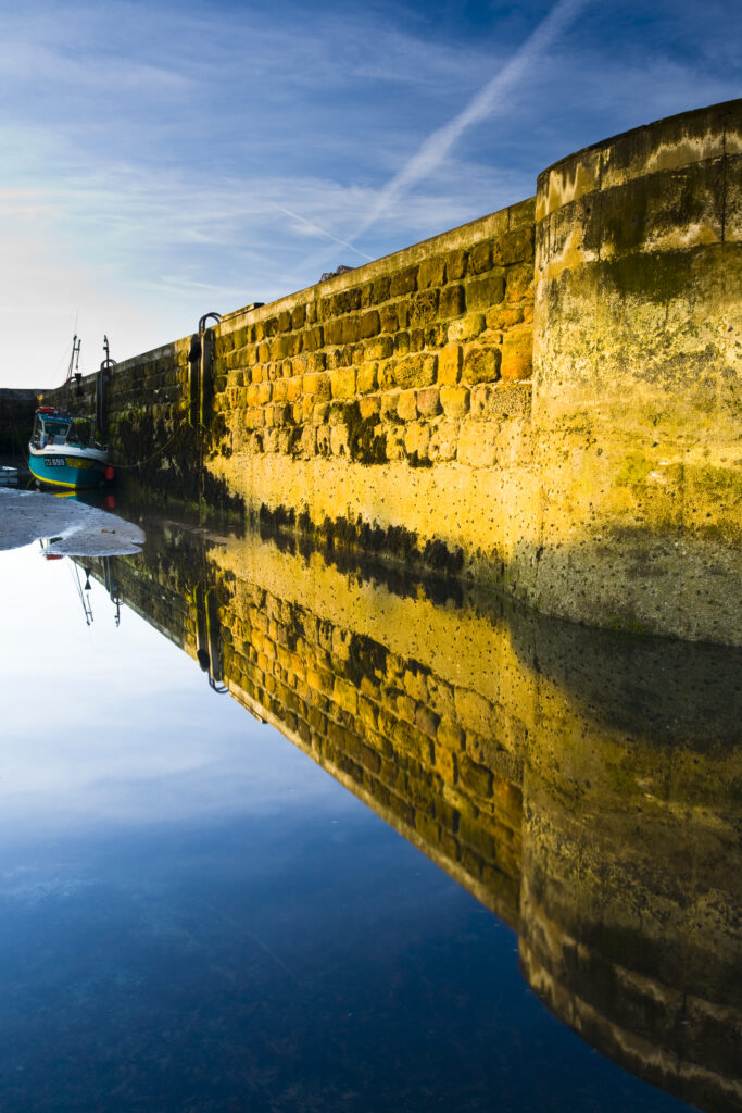 England, Northumberland, Beadnell. The Harbour Walls of the Beadnell Harbour viewed at low tide.