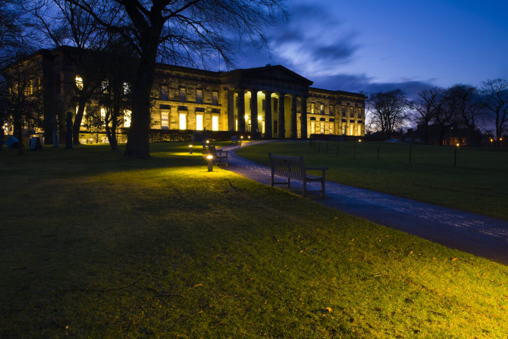 Scotland, Edinburgh, Scottish National Gallery of Modern Art. Flood lit gardens at the Scottish National Gallery of Modern Art.