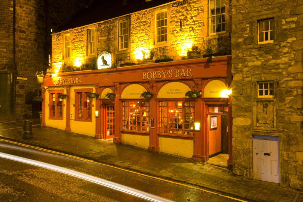 Scotland, Edinburgh, Greyfriars Bobby Bar. Greyfriars Bobby's Bar, a traditional public house located near the Greyfriars Kirk and the monument dedicated to the Greyfriars Bobby.