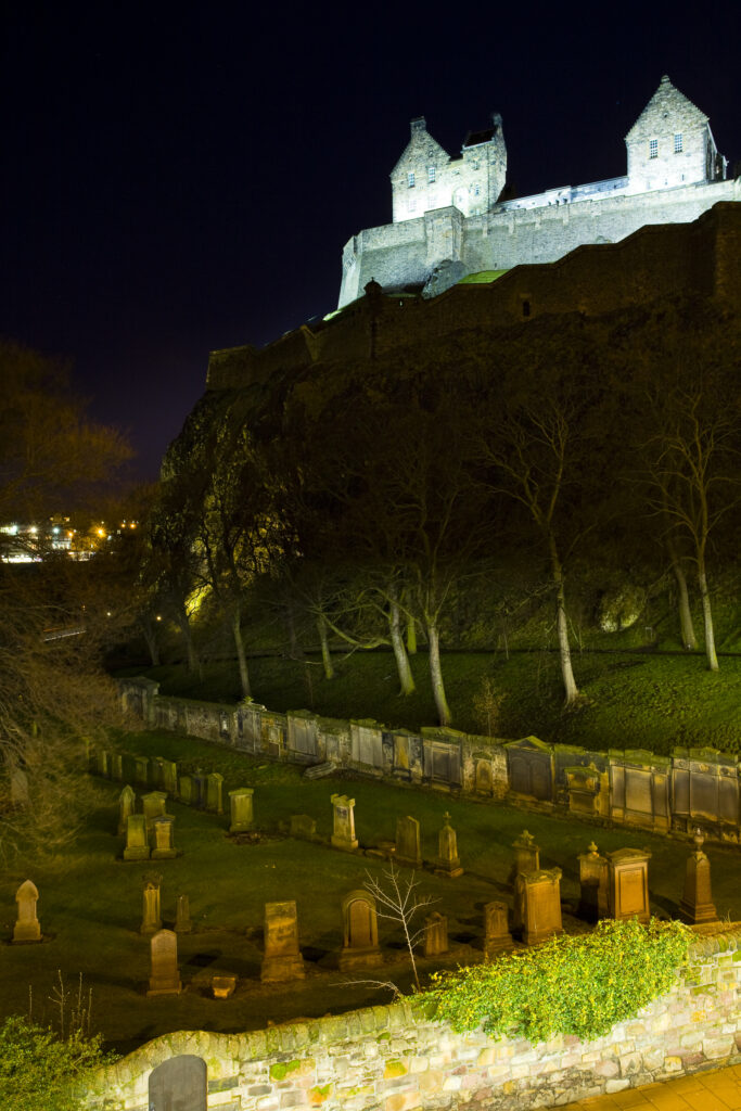 Scotland, Edinburgh, Edinburgh Castle. Edinburgh Castle high on Castle Rock, overlooking the graveyard of Saint Cuthberts.