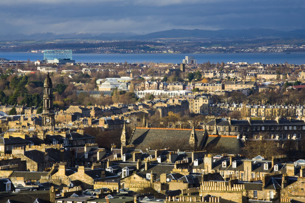 Scotland, Edinburgh, Calton Hill. Looking across Edinburgh City New Town to The Firth of Forth.