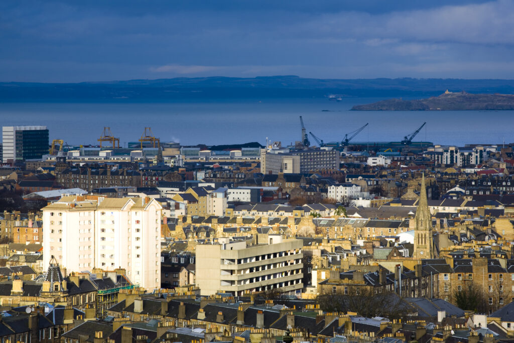 Scotland, Edinburgh, Calton Hill. Looking across Edinburgh City New Town to The Firth of Forth.
