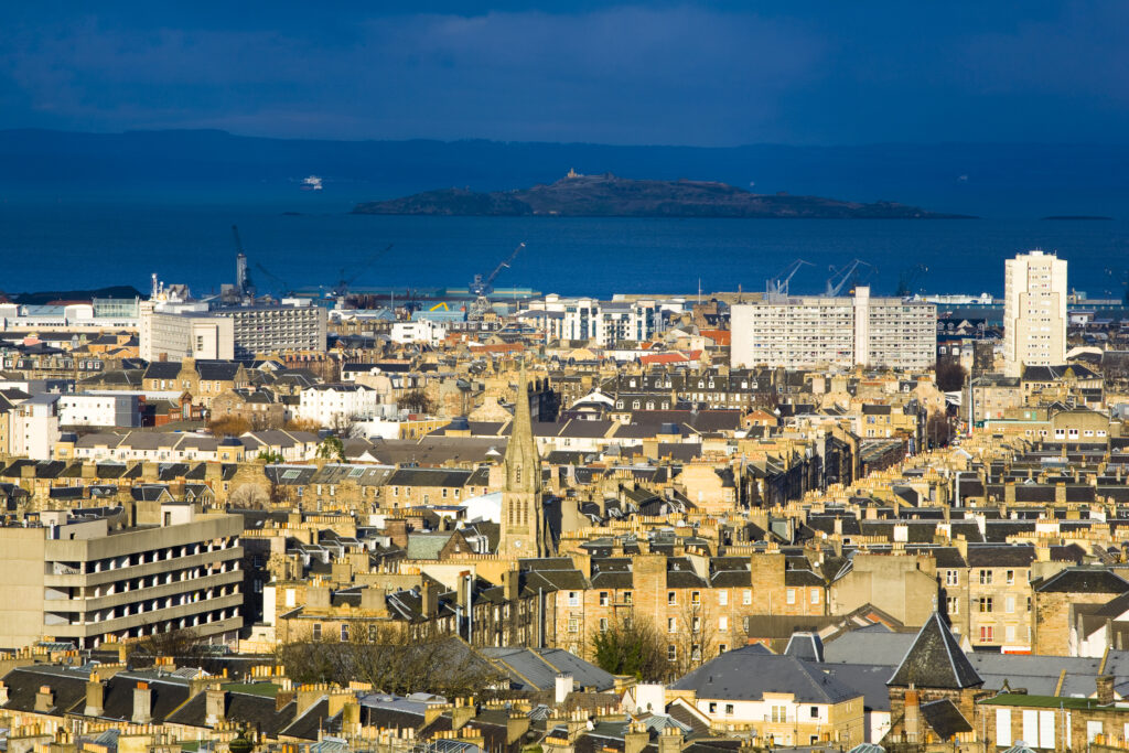 Scotland, Edinburgh, Calton Hill. Looking across Edinburgh City New Town to The Firth of Forth.
