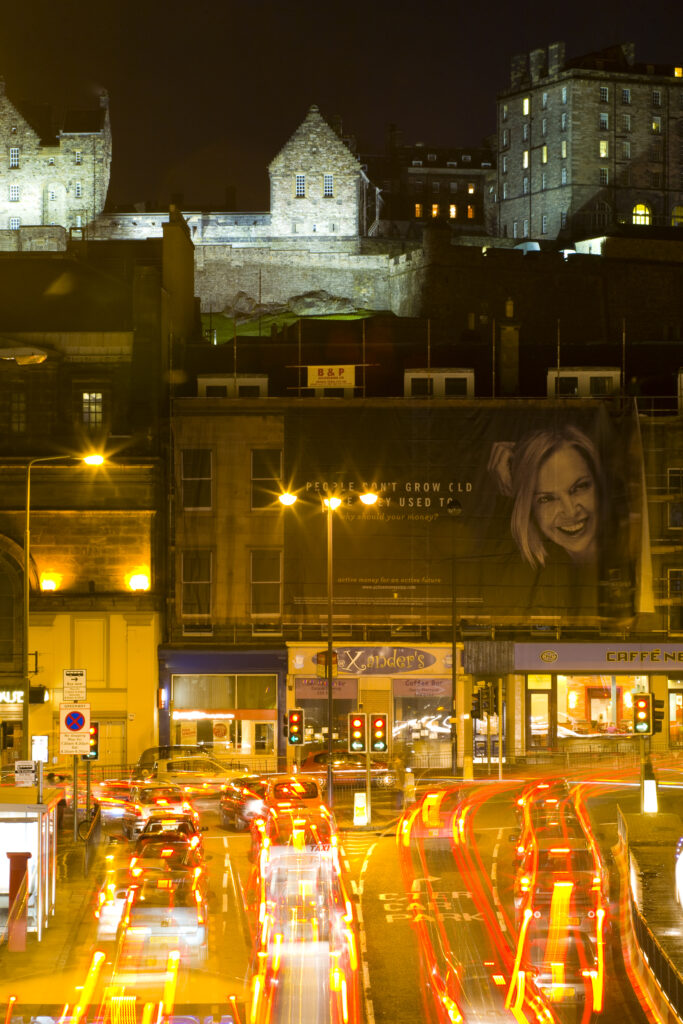 Scotland, Edinburgh, Edinburgh City. Edinburgh Castle overlooking rush hour traffic on the Lothian Road.