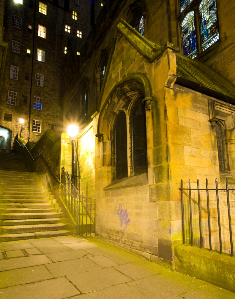 Scotland, Edinburgh, Old Town. Milne's Court, a narrow passageway heading to the Royal Mile, alongside the New College.