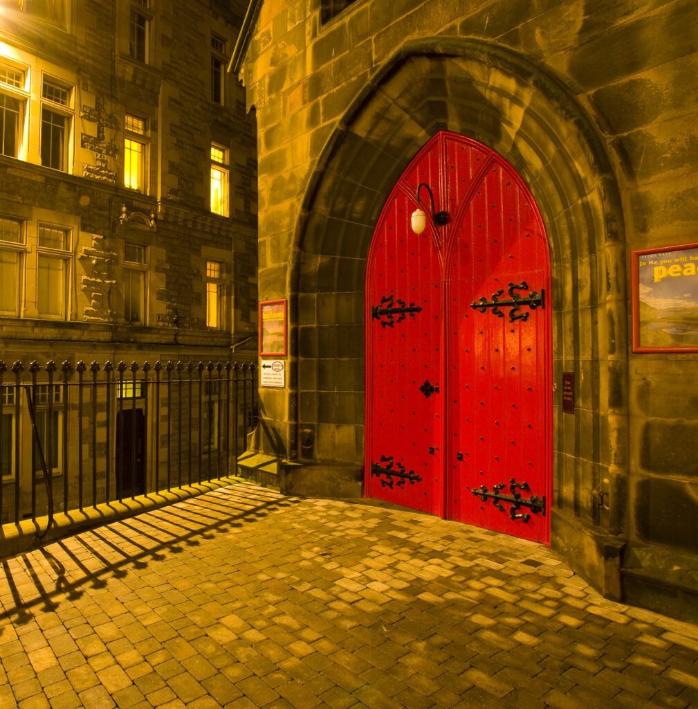 Scotland, Edinburgh, Old Town. Courtyard and doorway of the St. Columba's Church, known to many as St. Columba's by the Castle.