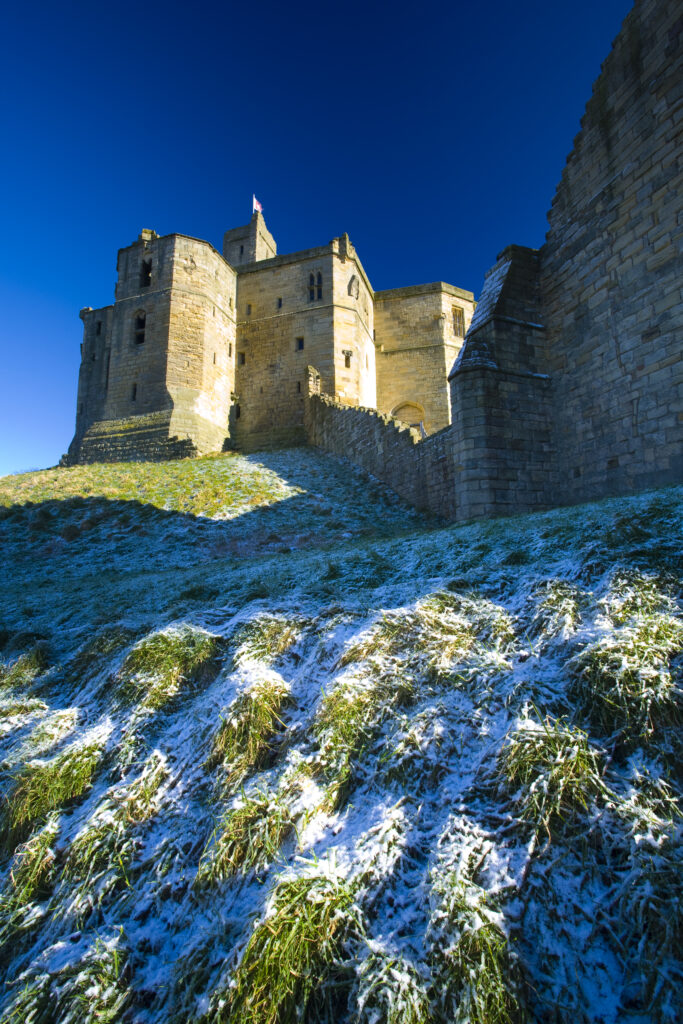 England, Northumberland, Warkworth Castle. Warkworth Castle (English Heritage), a magnificent 12th century stone motte and bailey fortress, located near the Northumberland Heritage Coast.