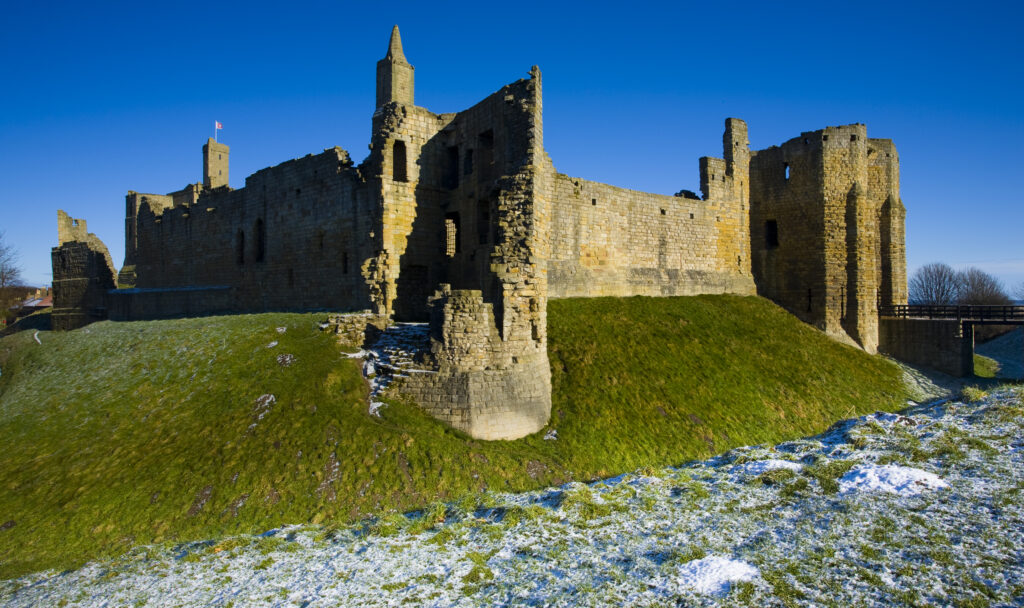 England, Northumberland, Warkworth Castle. Warkworth Castle (English Heritage), a magnificent 12th century stone motte and bailey fortress, located near the Northumberland Heritage Coast.