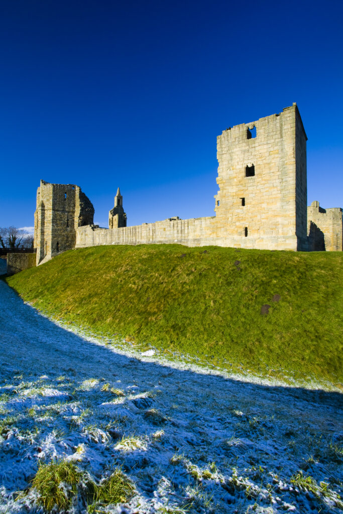 England, Northumberland, Warkworth Castle. Warkworth Castle (English Heritage), a magnificent 12th century stone motte and bailey fortress, located near the Northumberland Heritage Coast.