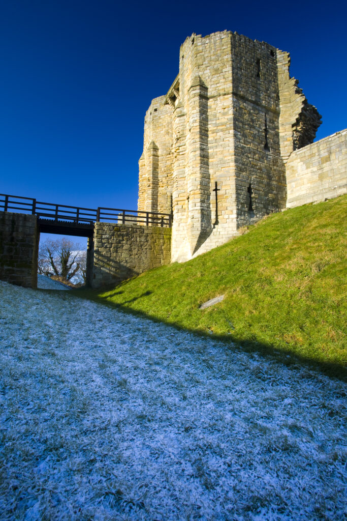 England, Northumberland, Warkworth Castle. Warkworth Castle (English Heritage), a magnificent 12th century stone motte and bailey fortress, located near the Northumberland Heritage Coast.