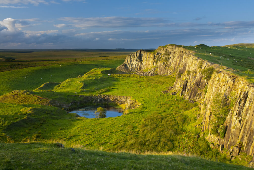 England, Northumberland, Hadrian's Wall. Walltown Crags and the route of Hadrians Wall along the Great Whin Sill.