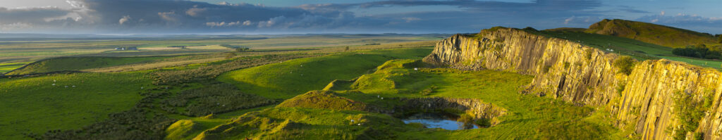 England, Northumberland, Hadrian's Wall. Walltown Crags and the route of Hadrians Wall along the Great Whin Sill.