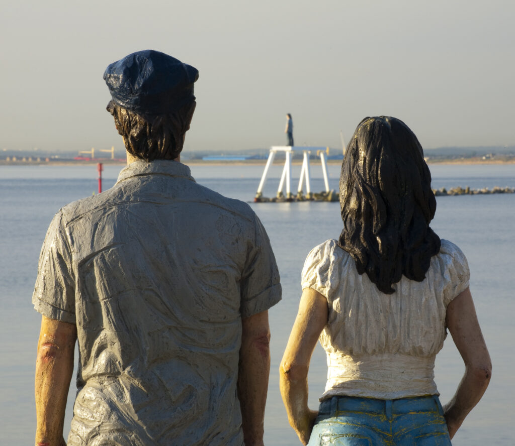 England, Northumberland, Newbiggin by the sea. 'The Couple' a sculpture by the artist and sculptor Sean Henry, located near the coast of Newbiggin by the Sea.