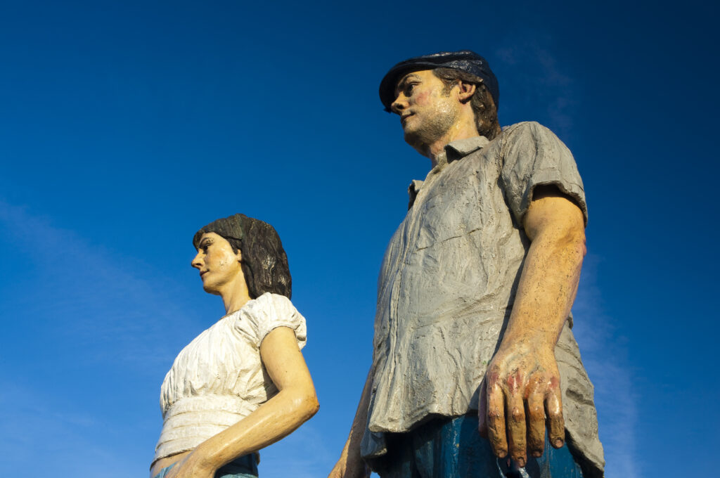 England, Northumberland, Newbiggin by the sea. 'The Couple' a sculpture by the artist and sculptor Sean Henry, located near the coast of Newbiggin by the Sea.