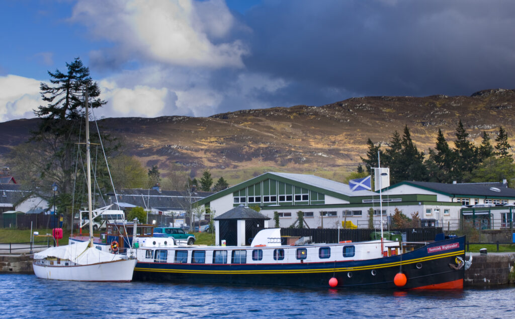 Scotland, Scottish Highlands, Fort Augustus. Tourist sight seeing barge moored on the Caledonian Canal in Fort Augustus.