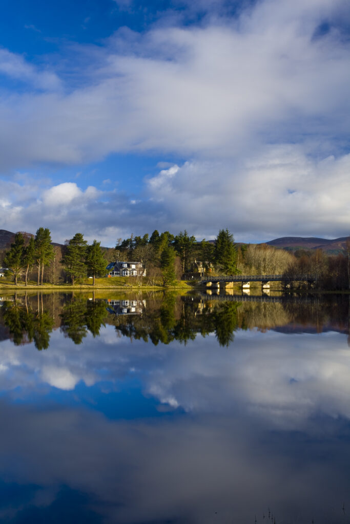 Scotland, Scottish Highlands, Cairngorms National Park. Mirror like reflections upon Loch Insh near Kincraig.