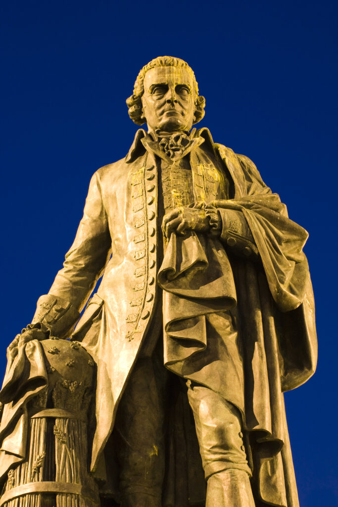 Scotland, Edinburgh, The Royal Mile. Statue of Adam Smith, considered by many to be the father of modern economics, looking towards his home town of Kircaldy across the river Forth.