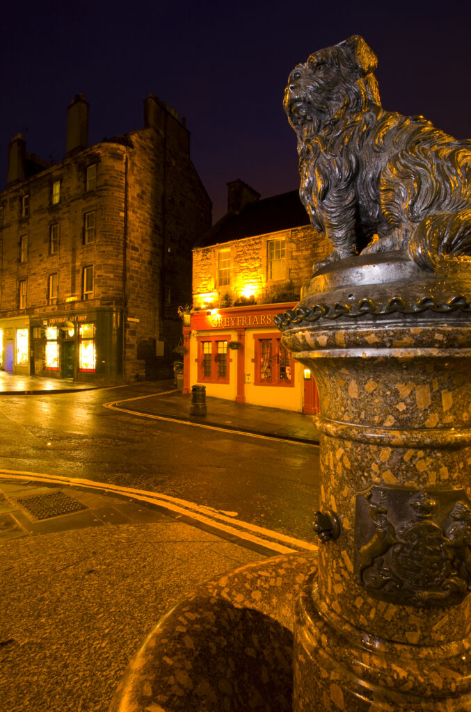 Scotland, Edinburgh, Greyfriars Bobby. Greyfriars Bobby, the famous loyal Skye Terrier who lay on the grave of his master John Gray for 14 years after his death in 1858 - Only leaving his grave briefly to find food.
