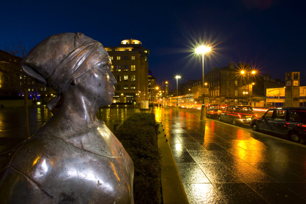Scotland, Edinburgh, Festival Square. African Woman and Child sculpture, a commissioned piece of work by Scottish sculptor and artist Anne Davidson, located on the corner of Festival Square and Lothian Road.