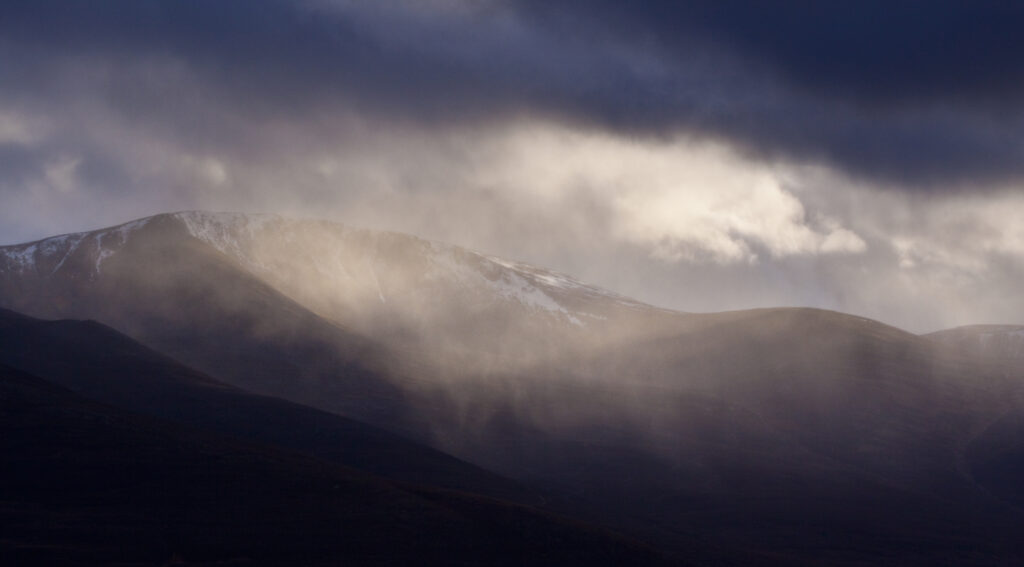 Scotland, Scottish Highlands, Cairngorms National Park. Storm clouds above the mountain known as Stac na h-Iolaire.