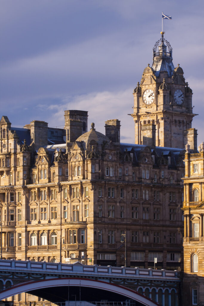Scotland, Edinburgh, Edinburgh City. Balmoral Hotel and clock tower with the North Bridge below, linking Princes Street with the Edinburgh Old Town.