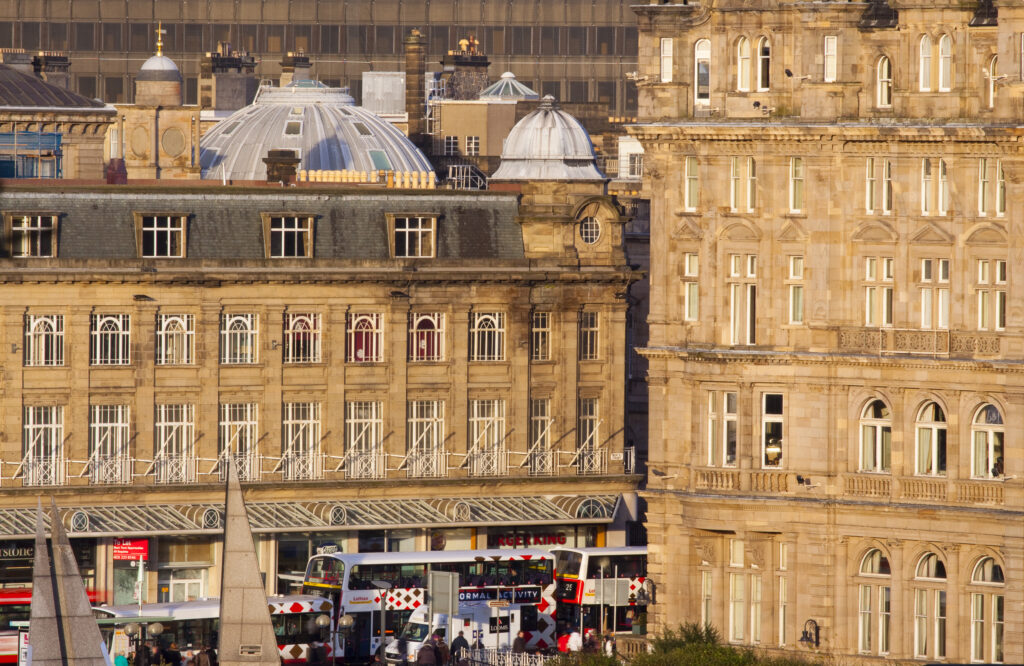 Scotland, Edinburgh, Princes Street. Typical architecture of the shops and offices located along the busy Princes Street.
