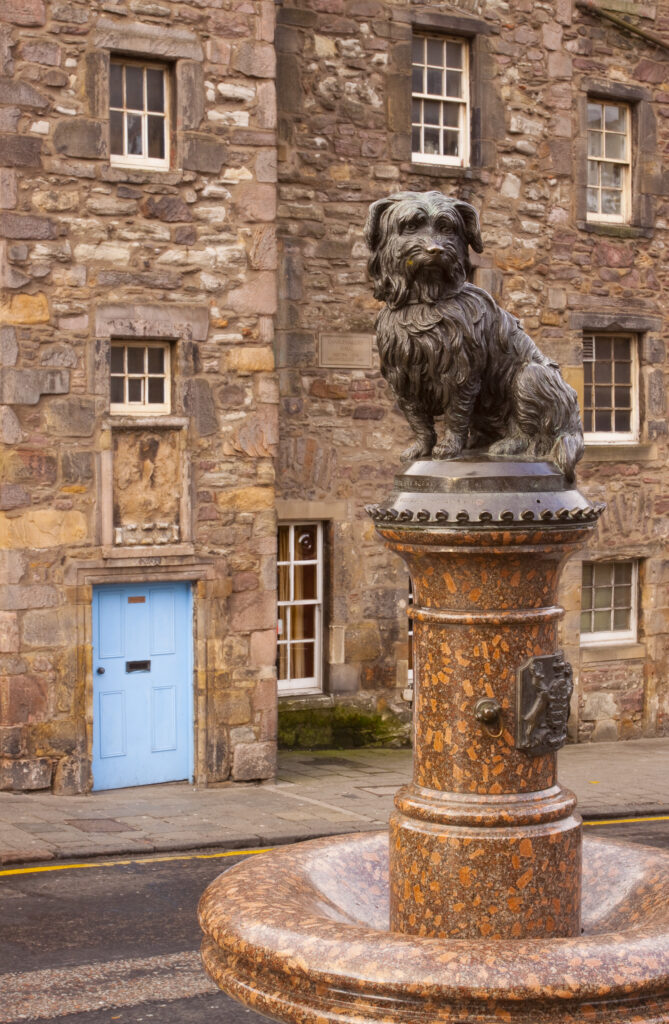 Scotland, Edinburgh, Greyfriars Bobby. Statue of Greyfriars Bobby, the famous loyal Skye Terrier who lay on the grave of his master John Gray for 14 years after his death in 1858 - Only leaving his grave briefly to find food.
