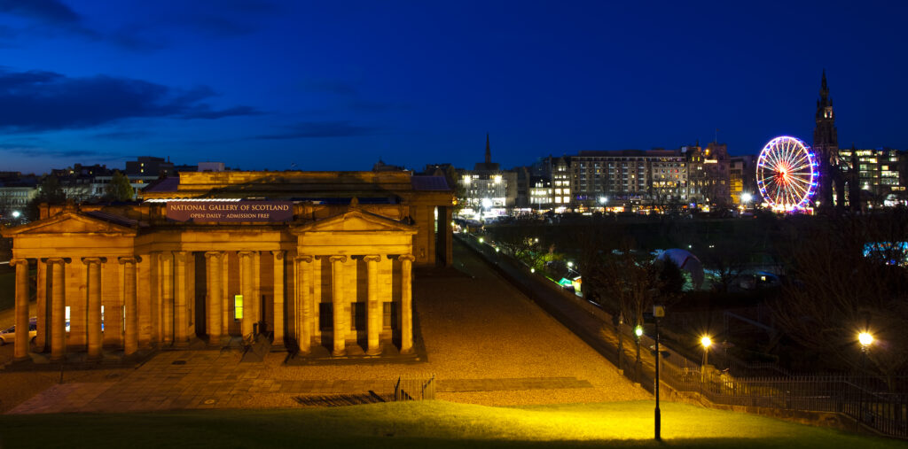 Scotland, Edinburgh, Princes Street. The National Gallery of Scotland, Princes Street and the Walter Scot monument viewed at dusk.