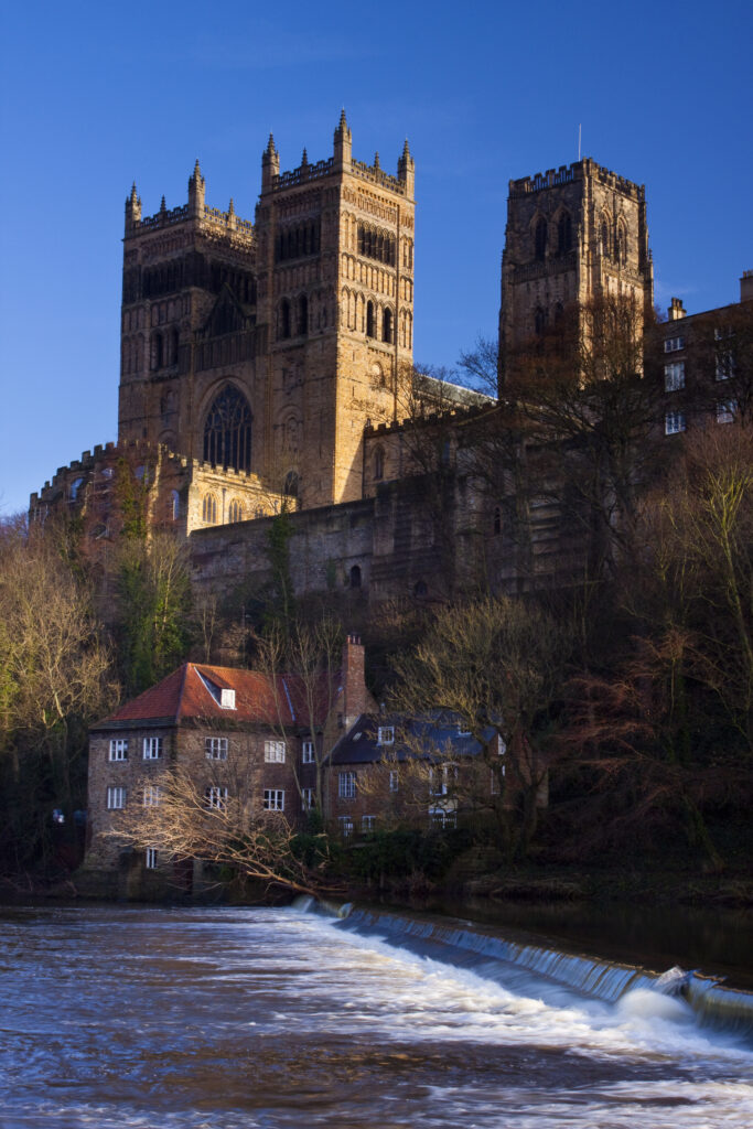 England, County Durham, Durham City. Durham Cathedral, situated above the river banks of the River Wear.