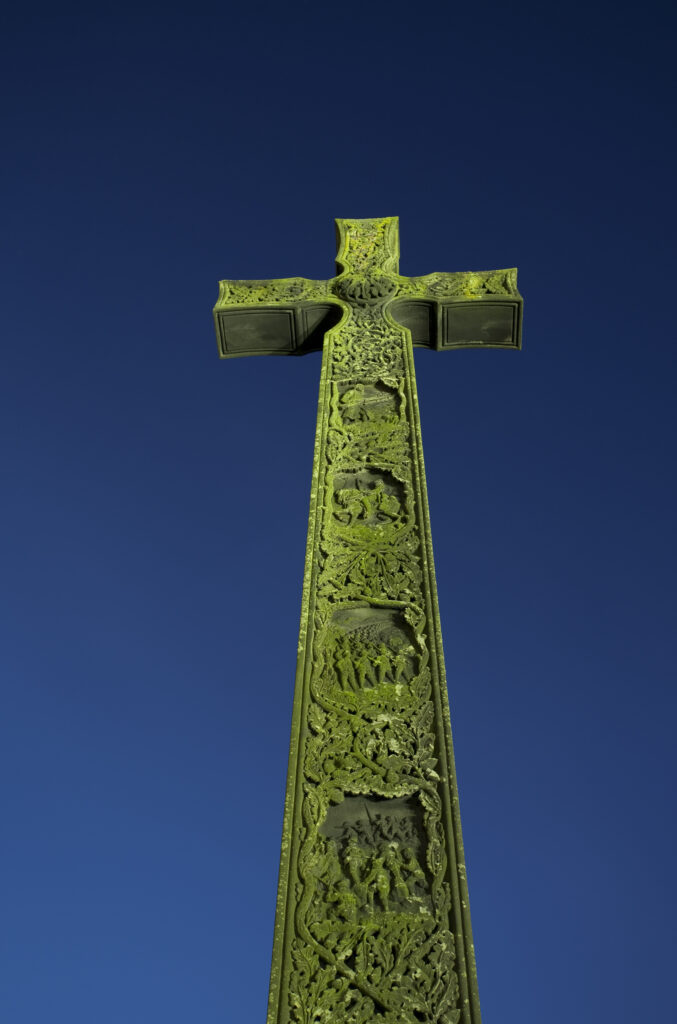 England, County Durham, Durham City. A war memorial in the shape of the Cross of St Cuthbert, next to Durham Cathedral.