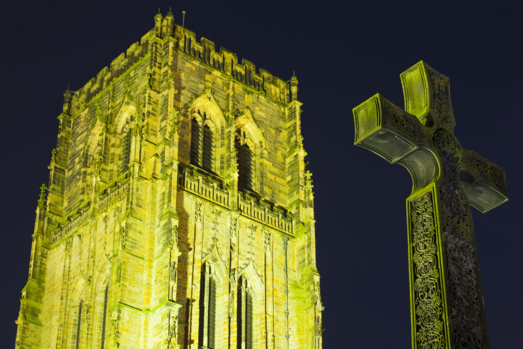 England, County Durham, Durham City. A war memorial in the shape of the Cross of St Cuthbert, next to Durham Cathedral.