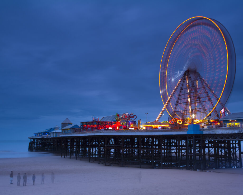 England, Lancashire, Blackpool. Blackpool Central Pier at dusk.