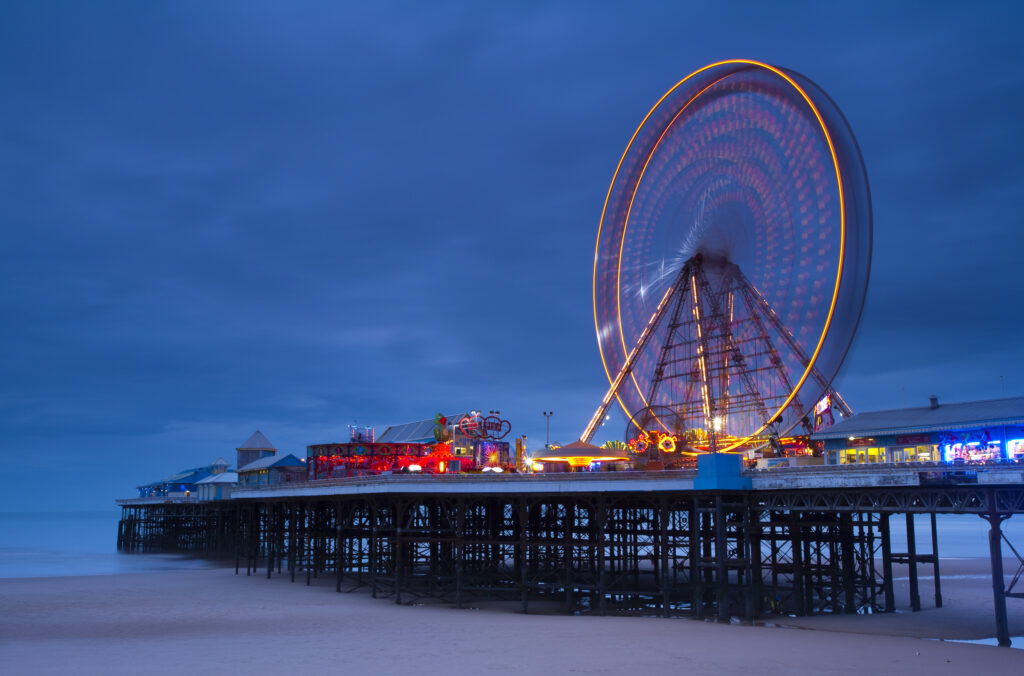 England, Lancashire, Blackpool. Blackpool Central Pier at dusk.