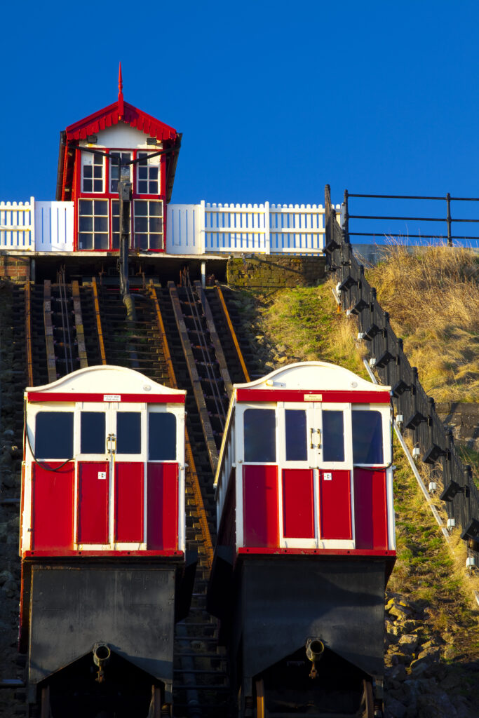 England, Cleveland, Saltburn-by-the-Sea. View looking towards the top of the funicular railway, one of the world's oldest water-powered cliff lifts, from the station near the pier.